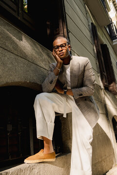 Black man wearing tailored blazer in urban street style portrait
