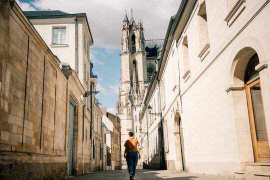 Walking Down a Historic Street in a Small Town With a Church