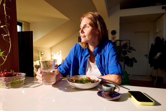 Woman enjoys the afternoon meal at home