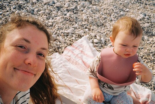 Selfie of mother and baby on the beach