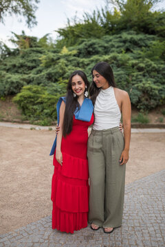 Two Young Women Celebrating Graduation in a Park Outdoors