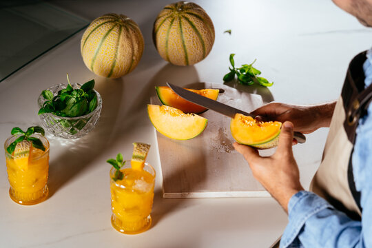 Bartender preparing cantaloupe melon refreshing summer cocktails