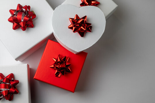 Decorative Gift Boxes With Red Bows on White Background