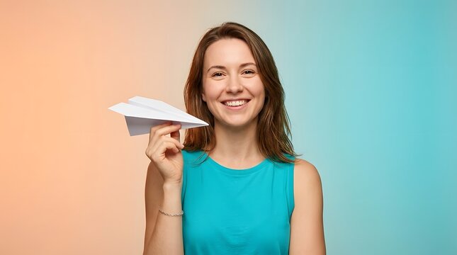 Woman, paper airplane and smiling for travel, dreams and business start. Female, startup and motivation with goals, achievement and vision. Launch, opportunity and creative ideas for marketing work