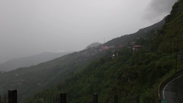 Giddha Pahar View Point in Kurseong, West Bengal, India, Scenic Himalayan Mountain Landscape Covered with Mist and Clouds, Green Hills, Foggy Weather, Mountain Tourism and Travel Background