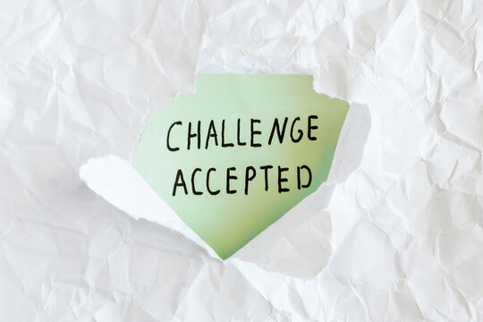 Challenge Accepted Handwritten Message Revealed Through Torn Paper, Motivation and Determination Concept