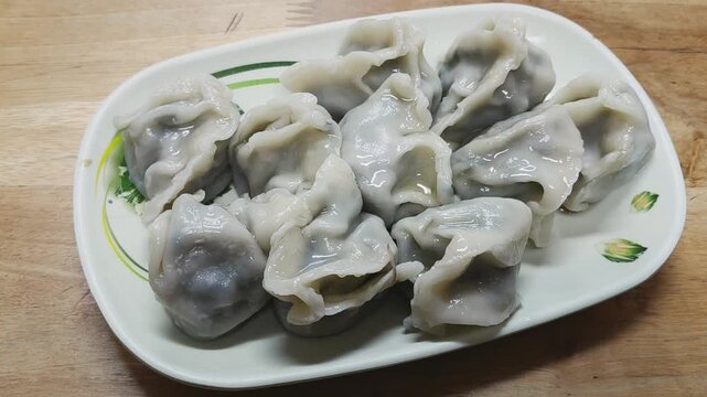 Freshly cooked dumplings arranged on a plate
