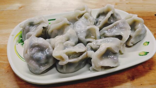 Freshly cooked dumplings arranged on a plate