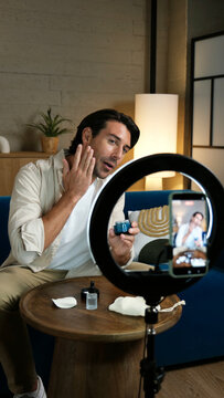 Man recording a video for social media about his daily skin care routine