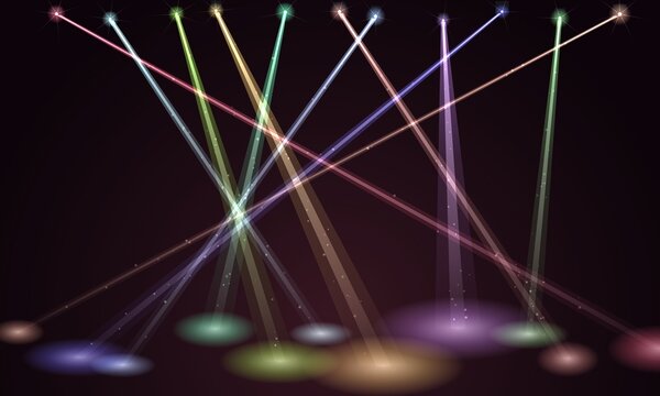 Colorful stage lights beam on dark background. Vibrant concert spotlights illuminate empty performance floor.
