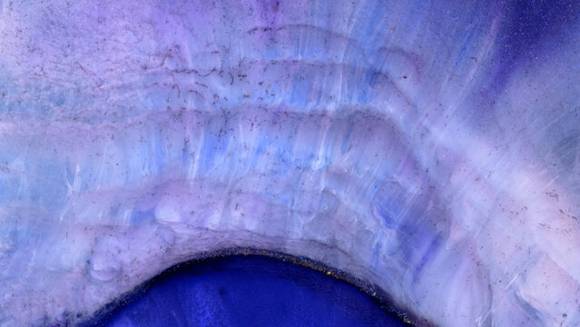 Close-up view of mixing alcohol inks with epoxy resin in different colors