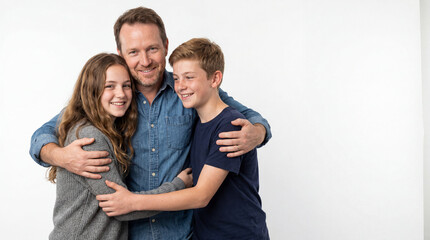 Fototapeta premium father hugging his teenage son and daughter together in studio setting family bonding and togetherness concept