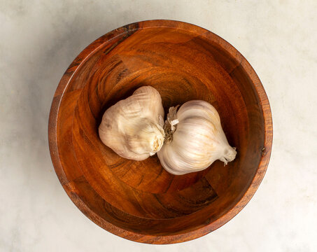  garlic in a wooden bowl