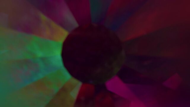 Round ball. Blur light circle. Defocused green blue red multicolor shine lens flare glare flicker gleam sphere glow on dark black abstract neon background.