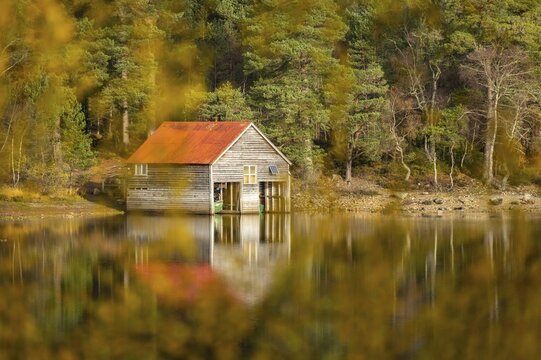 Boathouse on the shores of a lake in Scotland, Aviemore, Scotland, Great Britain