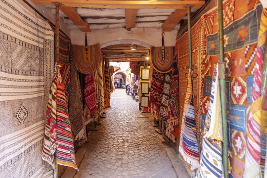 Narrow path with colorful, traditional carpets