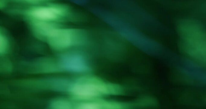 Bokeh texture. Neon light. Blue green color lens flare optical glisten kaleidoscope on abstract luminous dark black art background.
