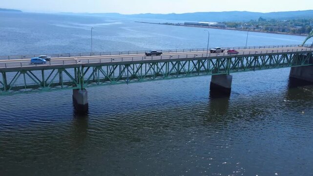Traffic view from drone moving along the J.C. Van Horne Bridge, highlighting the connection between New Brunswick and the Gasp&eacute; Peninsula.