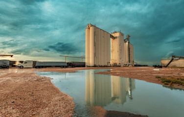 Industrial grain silos during a stormy day © cherylvb