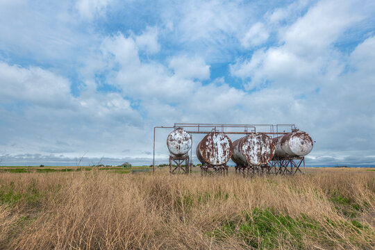 Old, rusting gas and fuel storage tanks