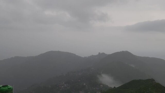 Giddha Pahar View Point in Kurseong, West Bengal, India, Scenic Himalayan Mountain Landscape Covered with Mist and Clouds, Green Hills, Foggy Weather, Mountain Tourism and Travel Background