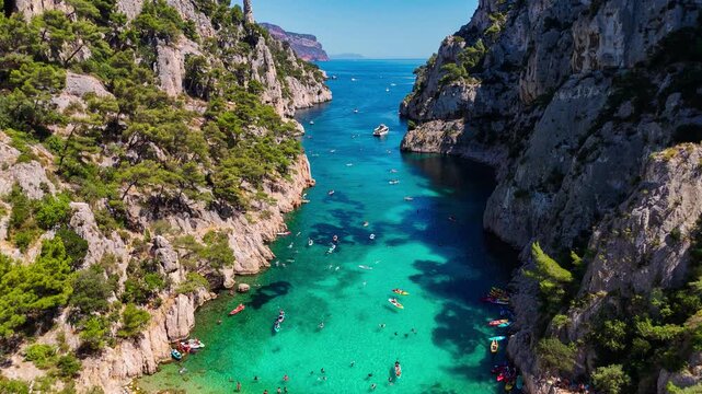 Aerial drone view of the calanques, also known as French fjords, winding bays with turquoise water among high cliffs. Provence, Alps, Cote dAzur, Marseille district, France. High quality 4k footage