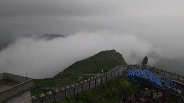 Giddha Pahar View Point in Kurseong, West Bengal, India, Scenic Himalayan Mountain Landscape Covered with Mist and Clouds, Green Hills, Foggy Weather, Mountain Tourism and Travel Background