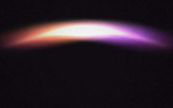 Bright multicolored curved light streaks on dark background