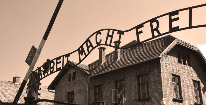 AUSCHWITZ BIRKENAU POLAND: Auschwitz concentration camp ARBEIT MACHT FREI sign was a network of German Nazi concentration camps and extermination camps built and operated by the Third Reich.