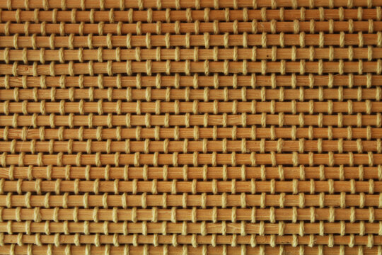 Woven bamboo mat close up for natural rustic styling and traditional organic craft material graphic design