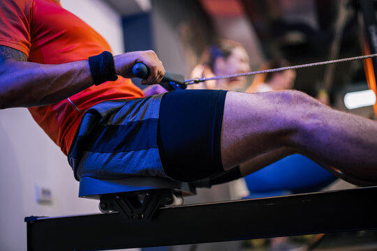 Close-up of athlete using indoor rowing machine