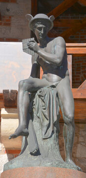 KRACOW POLAND: Bronze of Mercury is the patron god of financial gain, commerce, eloquence and communications. This sculpture is near St. Florian's Gate by Bertel Thorvaldsen
