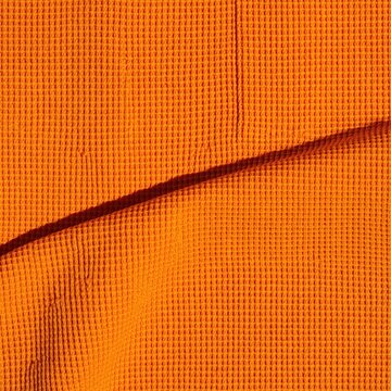 Ochre pique knit fabric texture with a rich golden sheen and a single stitch line, tactile and crisp for team uniform and workwear design
