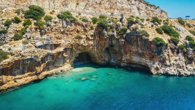 Magarali Koy coastal landscape featuring turquoise waters and unique sea caves in Antalya, Turkiye.