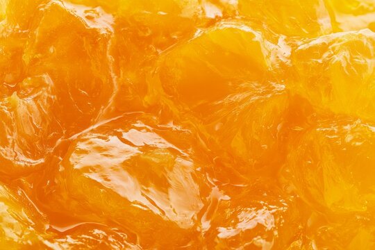 Bright orange jelly with shiny surface in close-up view
