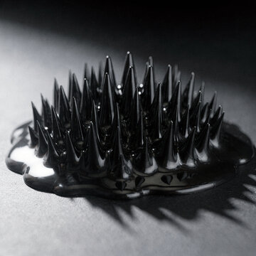 Black Ferrofluid Forming Sharp Glossy Spikes Over a Magnet