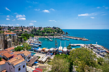 Fototapeta premium Kaleici rooftops and old harbor viewed from an elevated terrace in Antalya, Turkey.