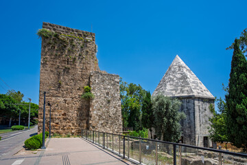 Fototapeta premium Historic stone tower and domed building in Kaleici Old Town, Antalya, Turkey.