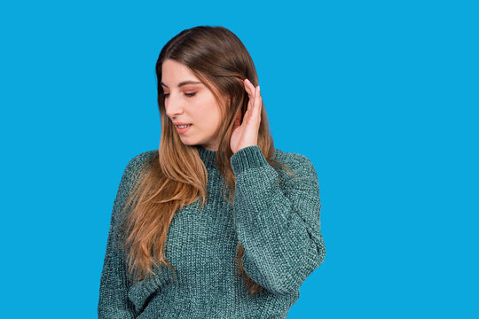 Woman eavesdropping and listening to a secret conversation