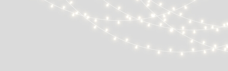 PNG glowing Christmas light chain with warm amber bulbs and elegant curves. Transparent isolated decoration fits many layouts. Great for festive banners. © Extrastock