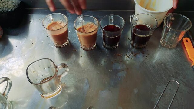 Traditional Bengali Milk Tea Served in Small Glass Cups on a Metal Serving Tray