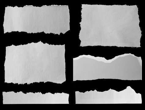 Torn papers on black