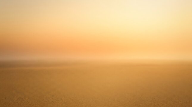 Abstract soft golden morning light background featuring warm glowing sunrise haze and blurred desert landscape for artistic digital design.