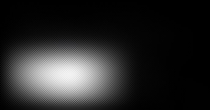 Abstract texture featuring a pattern of small dark dots with a glowing spotlight effect center
