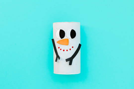 Christmas toy from toilet tube roll, paper toy santa claus, snowman, reindeer, tree rabbit on yellow background. Holiday easy kids DIY, decoration idea for winter season, home party. Children's crafts