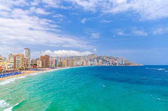 Aerial panoramic view of Old town Benidorm city centre Levante, coastline with skyscrapers buildings on Costa Blanca coast Mediterranean Sea azure water in summer day, Valencian Community, Spain