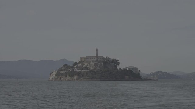 Alcatraz Island prison viewed from a boat in San Francisco Bay, California, USA
