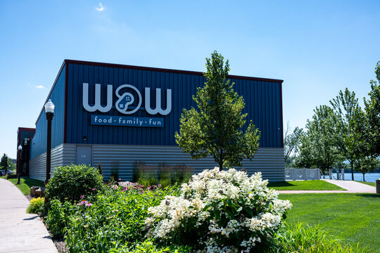 Wausau WI, USA - Jul 12, 2026: The WOW Family Entertainment Center situated along a waterfront path. Editorial Use Only.