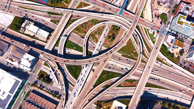 Lively traffic by the highways, loops and elevated roads. Busy modern interchange of Chicago, Illinois, USA. Top view.