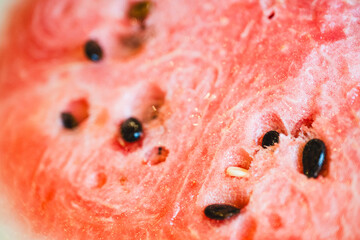 macro close-up of ripe, cut watermelon with pink gradient and seeds. fruit banner with copy space. heirloom gardening © mailcaroline